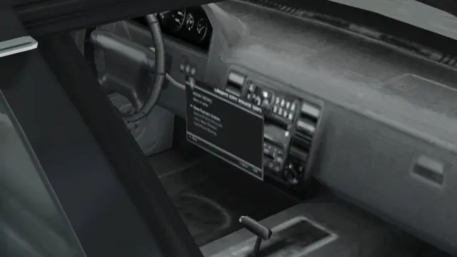 فضای داخلی Stanier در نسخهی اصلی GTA V. به صفحهی کامپیوتر شناور توجه کنید.